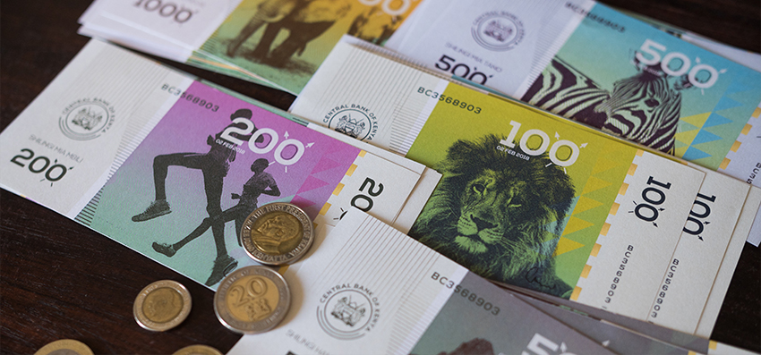 Modern Kenyan shilling concept notes arranged on a desk